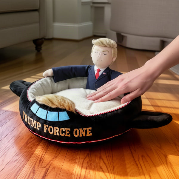 The bed on a hard floor with a hand pressing the cushion and a view of the underside base