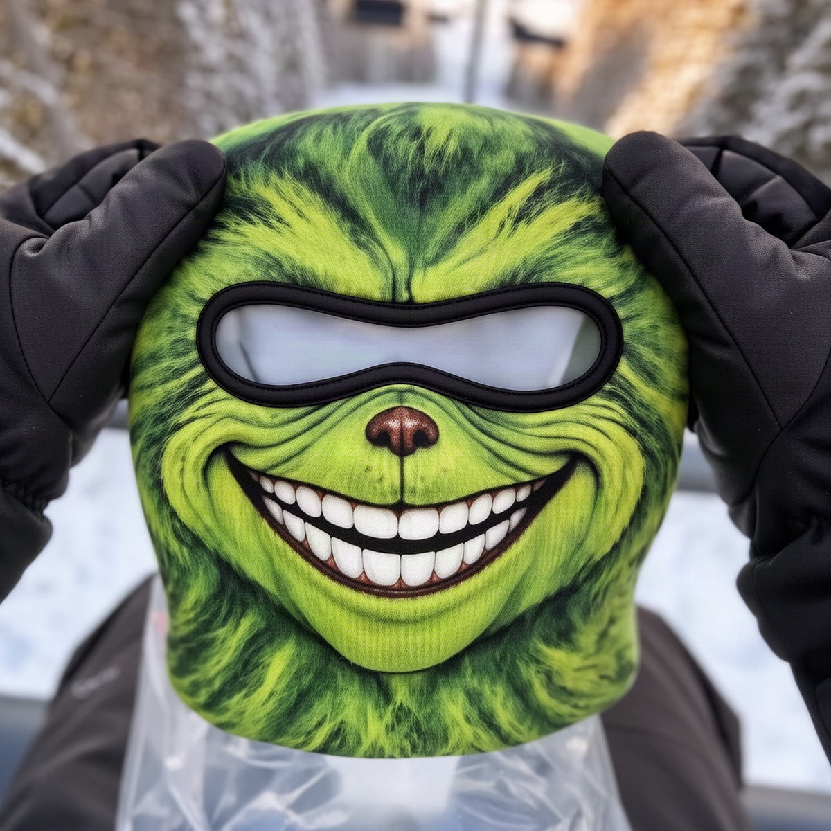 Close-up of the green furry face print with the toothy grin and brown nose