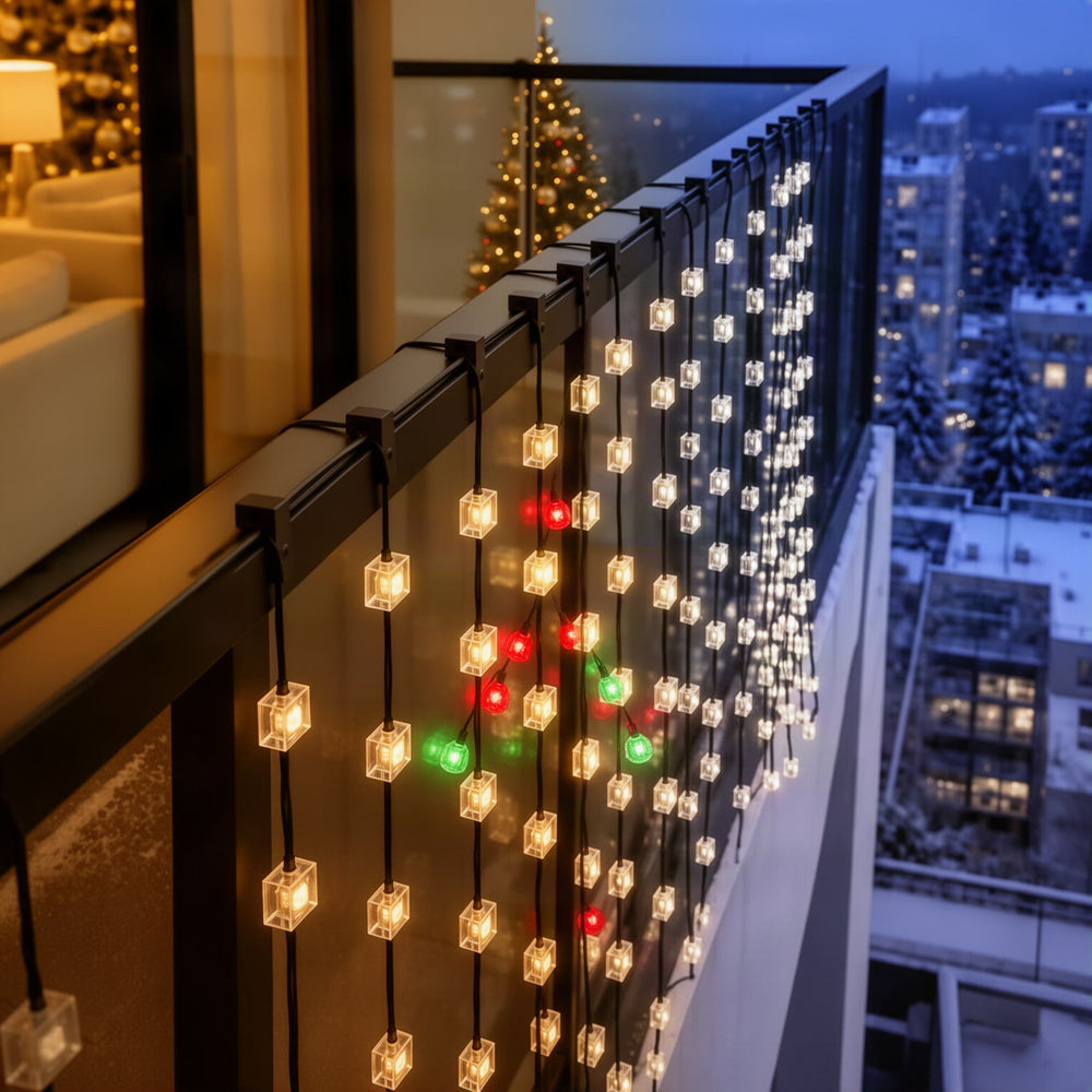 Lifestyle hero: curtain glowing on a balcony glass railing at night in a festive setting